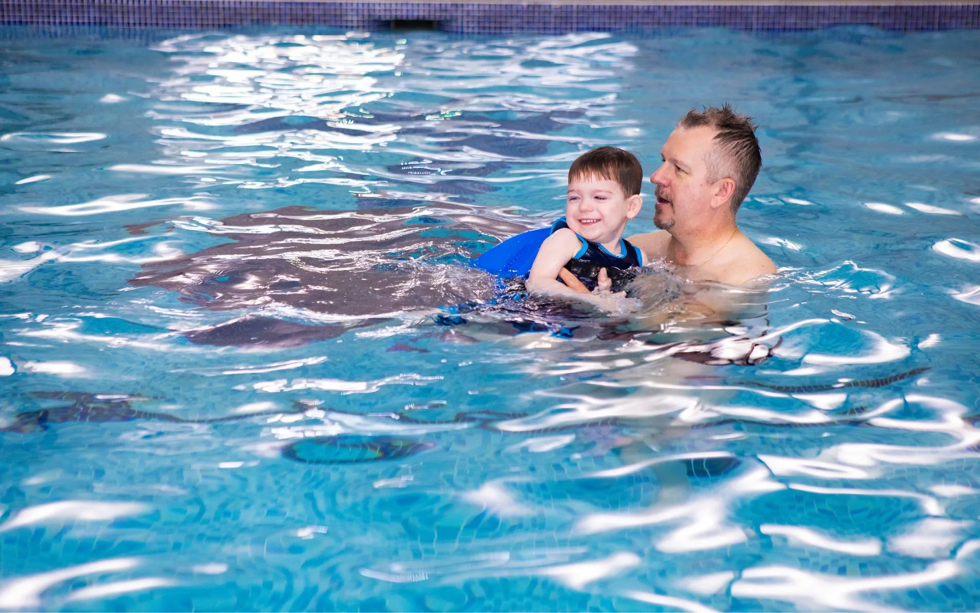 Searles Leisure Resort Indoor Father son swim Lifestyle